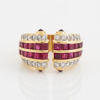 Step cut ruby and brilliant cut diamond ring.
