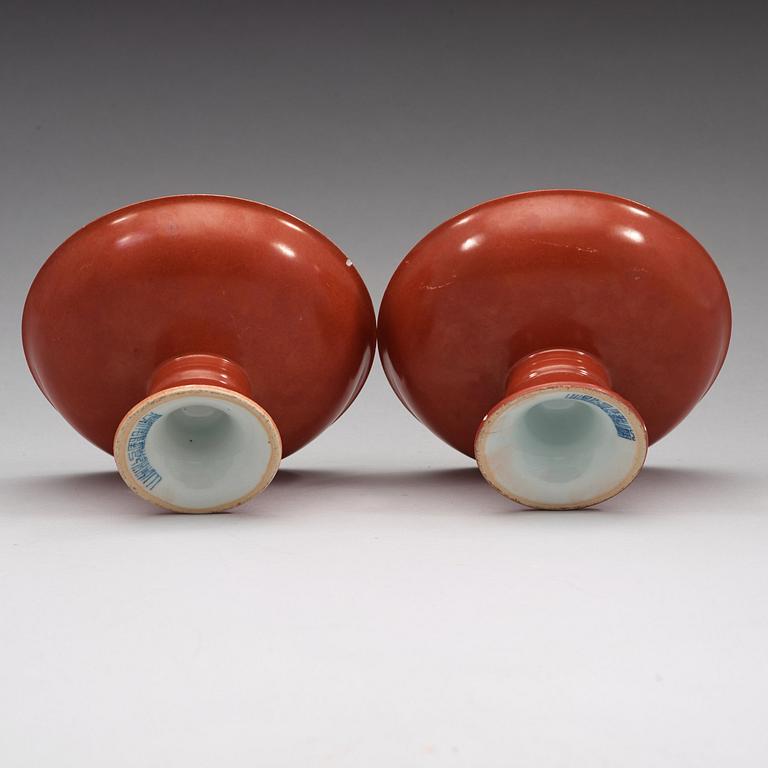 A pair of red glazed tazzas, Qing dynasty with Qianlong sealmark in underglaze blue.