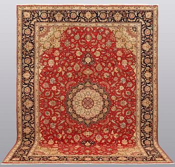 A carpet, Täbriz part silk, 341 x 248 cm.