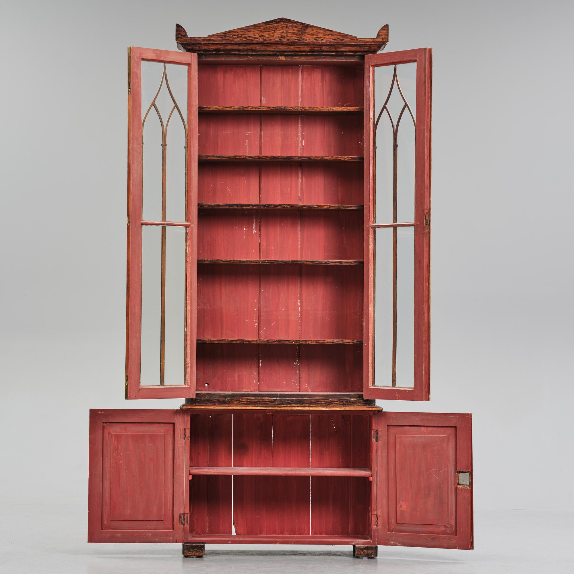 A Swedish faux-boix neo-gothic book cabinet, ca 1830.