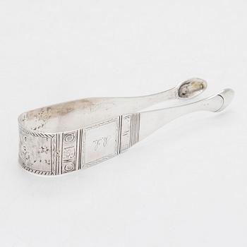 Cream jug, cake server, and sugar tongs in silver, Finland from latter part of the 18th century to 1854.