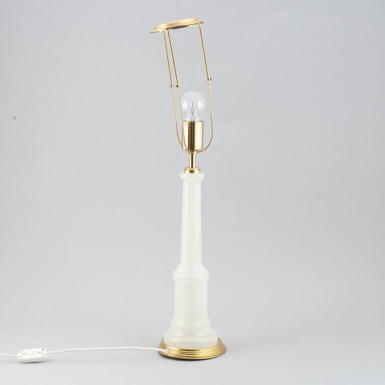 A brass and glass table lamp with lamp-shade. Svenskt Tenn, model no. 2583.