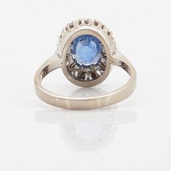 An 18K whithe gold ring set with a faceted sapphire weight 3.93 cts according to engraving.