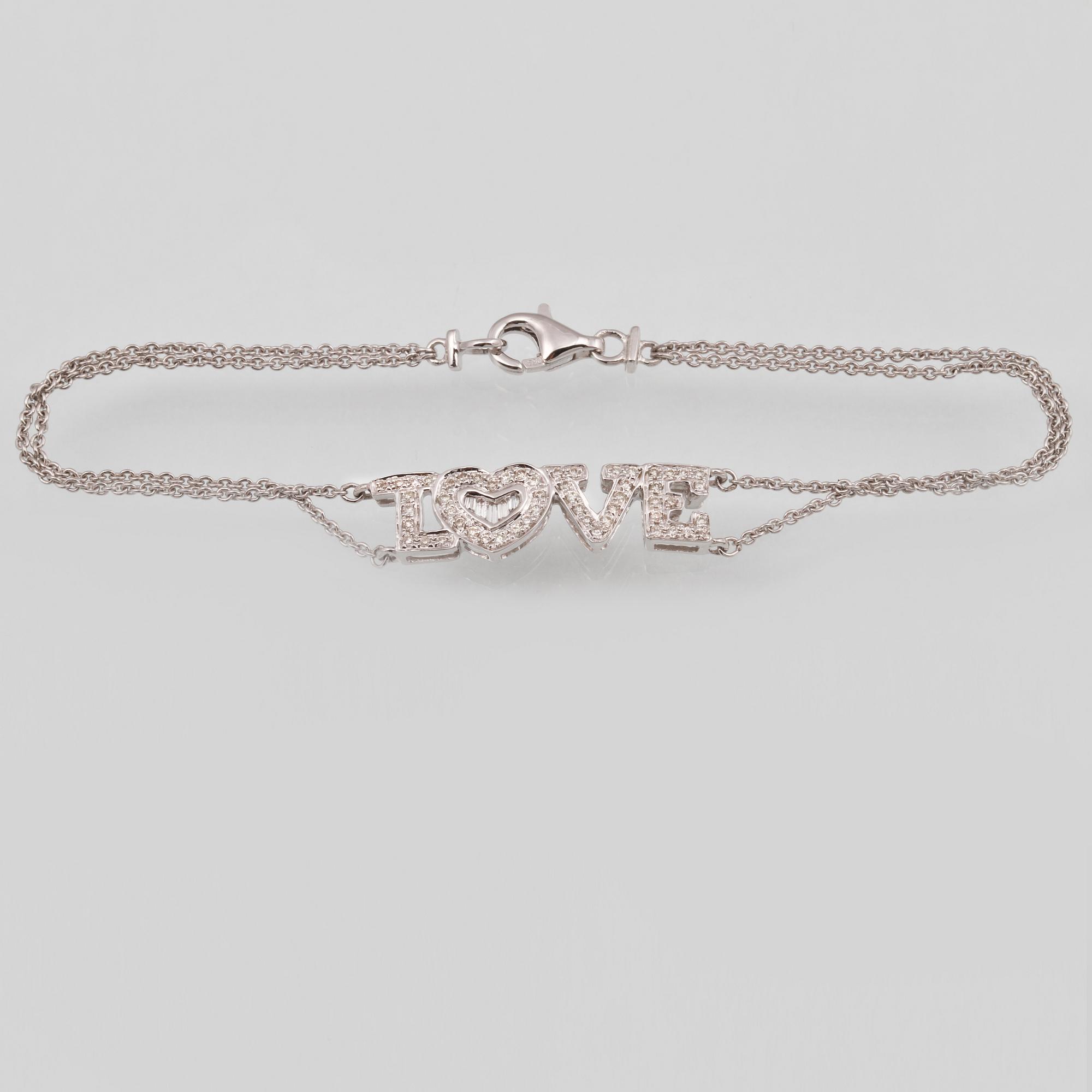 ARMBAND, 18K vitguld med briljant och baguettslipade diamanter ca 0.19 ct. Vikt 2,9 gram.