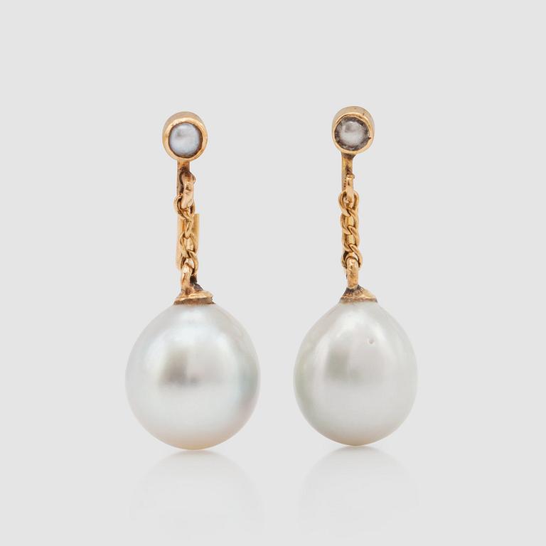 A pair of cultured pearl earrings.