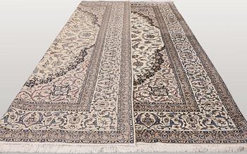 A Nain part silk carpet, 407 x 304 cm.