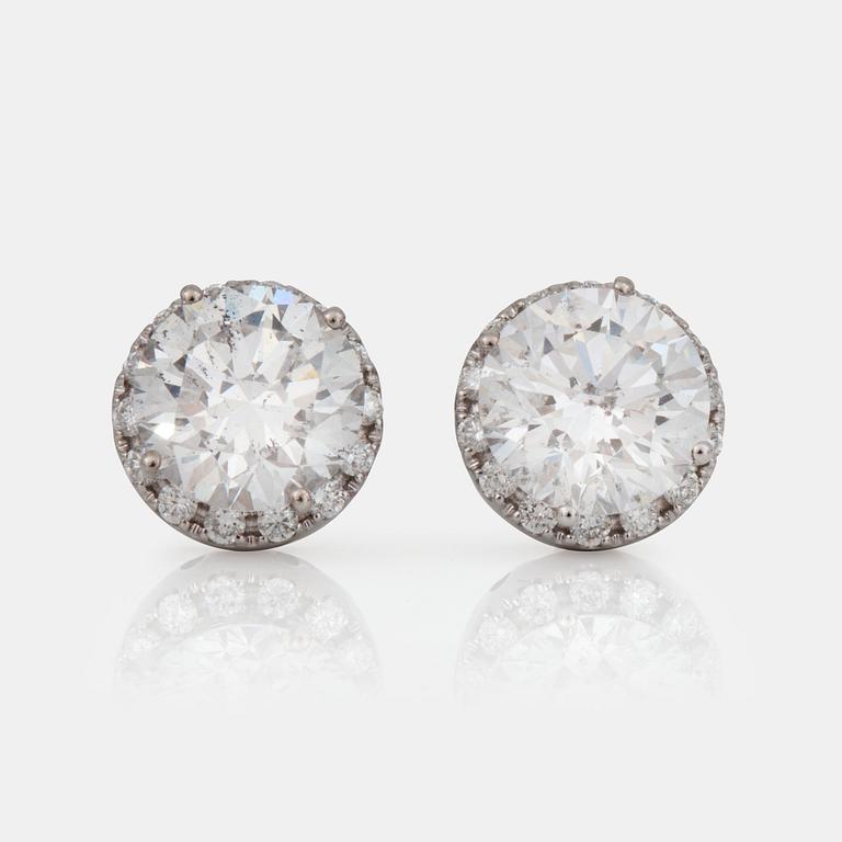 A pair of brilliant-cut diamond earrings. 2.07 cts and 2.11 cts, D-E/SI2, according to certificates from HRD and IGI.