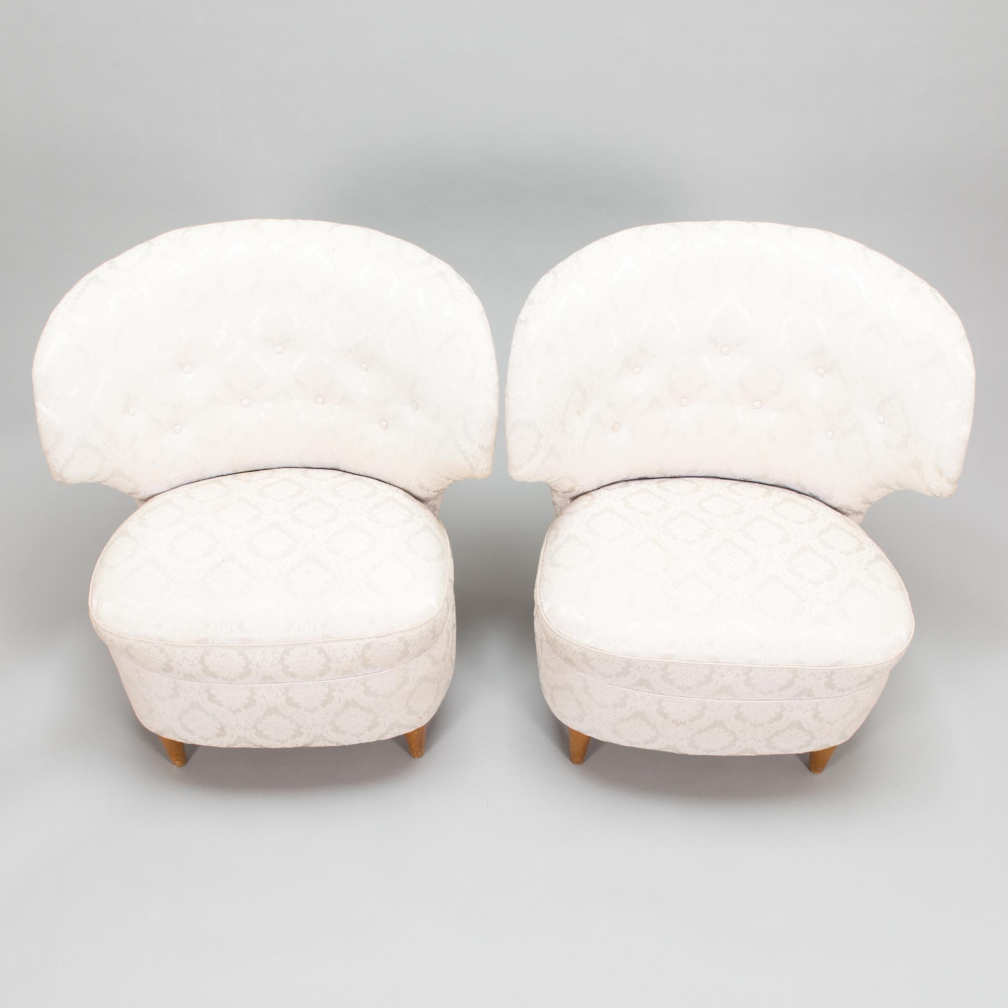 A pair of 1950's armchairs.