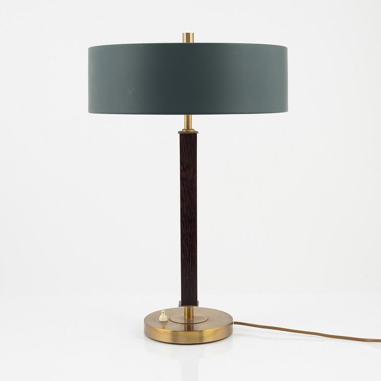 Einar Bäckström, a brass and rosewood table light, Malmö, mid 20th Century.
