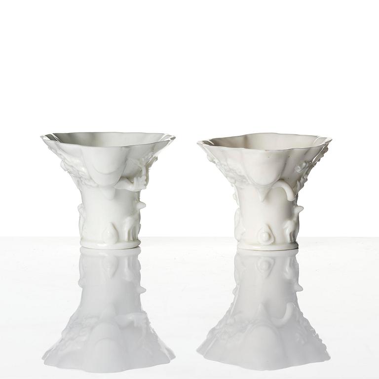 A pair of blanc de chine rhinoceros libation cups, Qing dynasty, Kangxi (1662-1722).