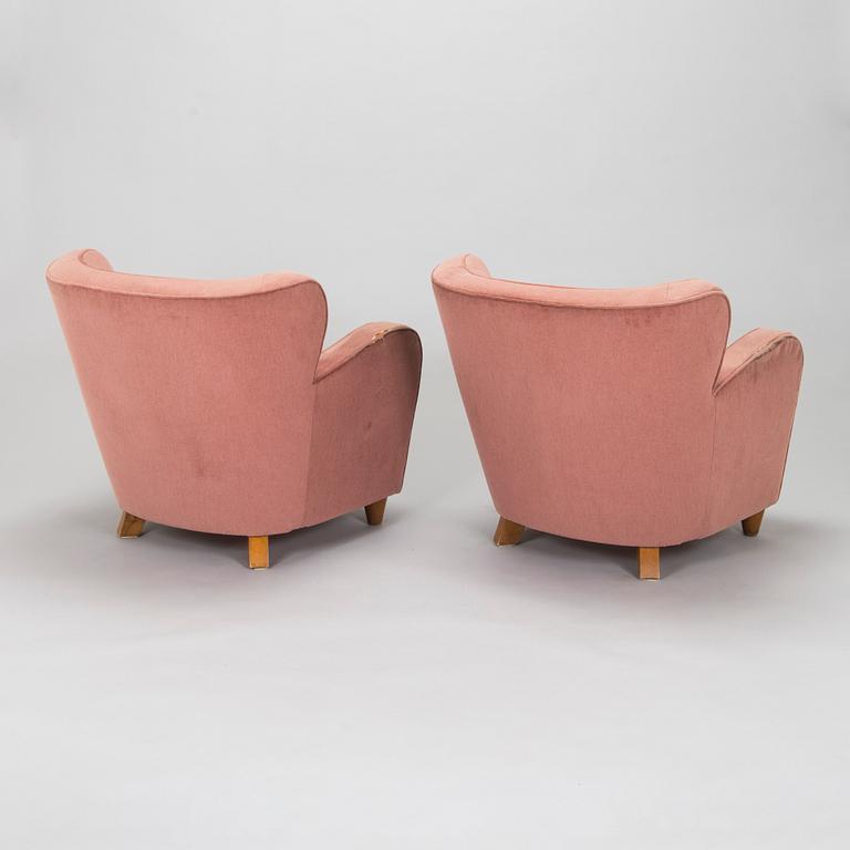A pair of mid-20th century armchairs.