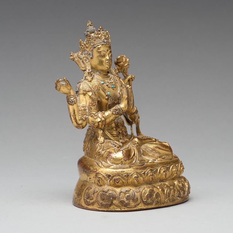 A gilt copper alloy four armed Sadaksari Avalokiteshvara, Tibet/Nepal, 15th Century or older.