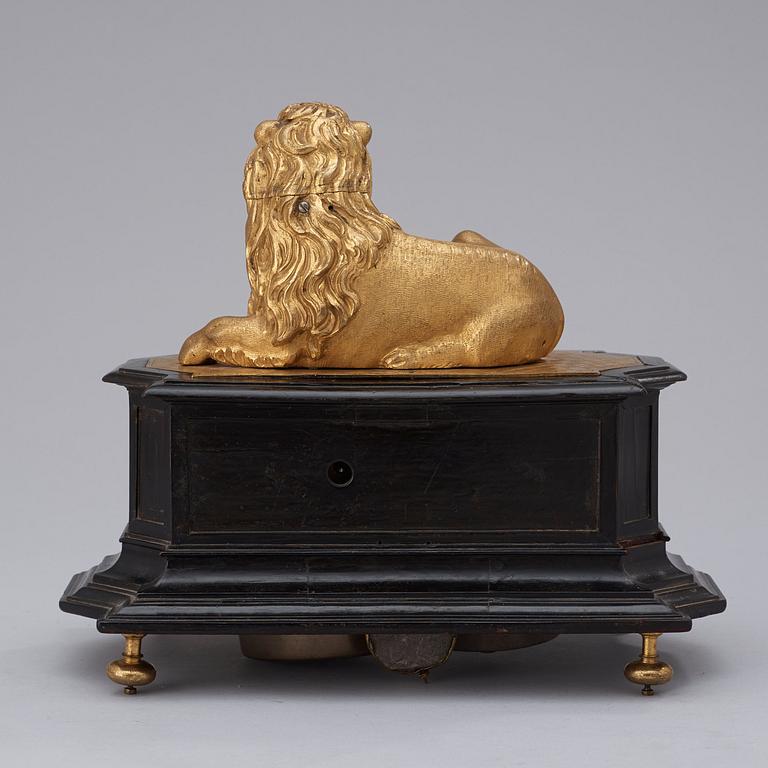 A rare gilt brass on ebonised base Lion Automaton figure clock, Augsburg circa 1630.