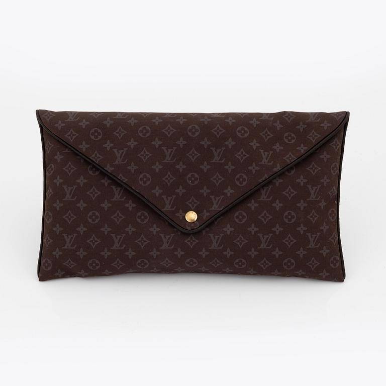 Louis Vuitton, a monogram "Trousse kit de voyage' travel kit with inflatible pillow and eye mask.