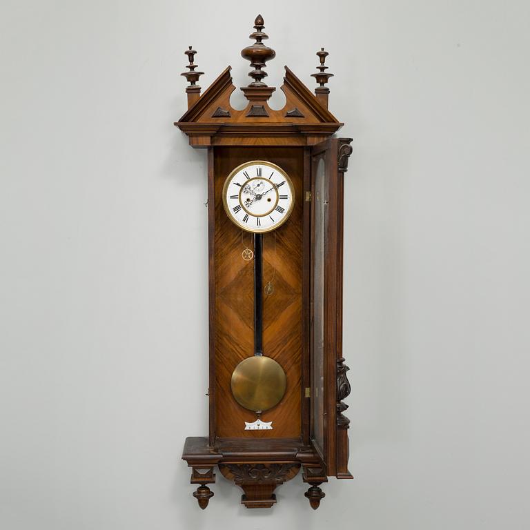 A late 19th century wall pendulum clock.