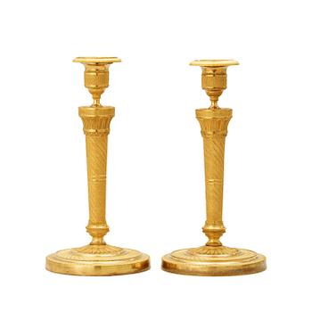 1294. A pair of French Empire 19th century candlesticks.