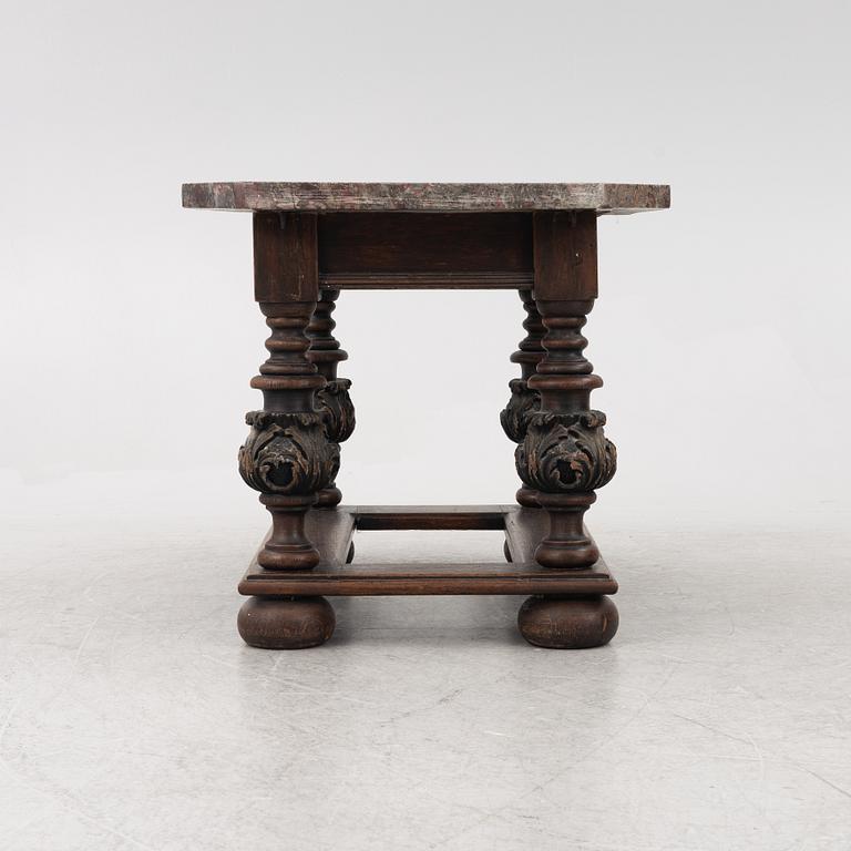A 19th century Baroque style stone-top table.