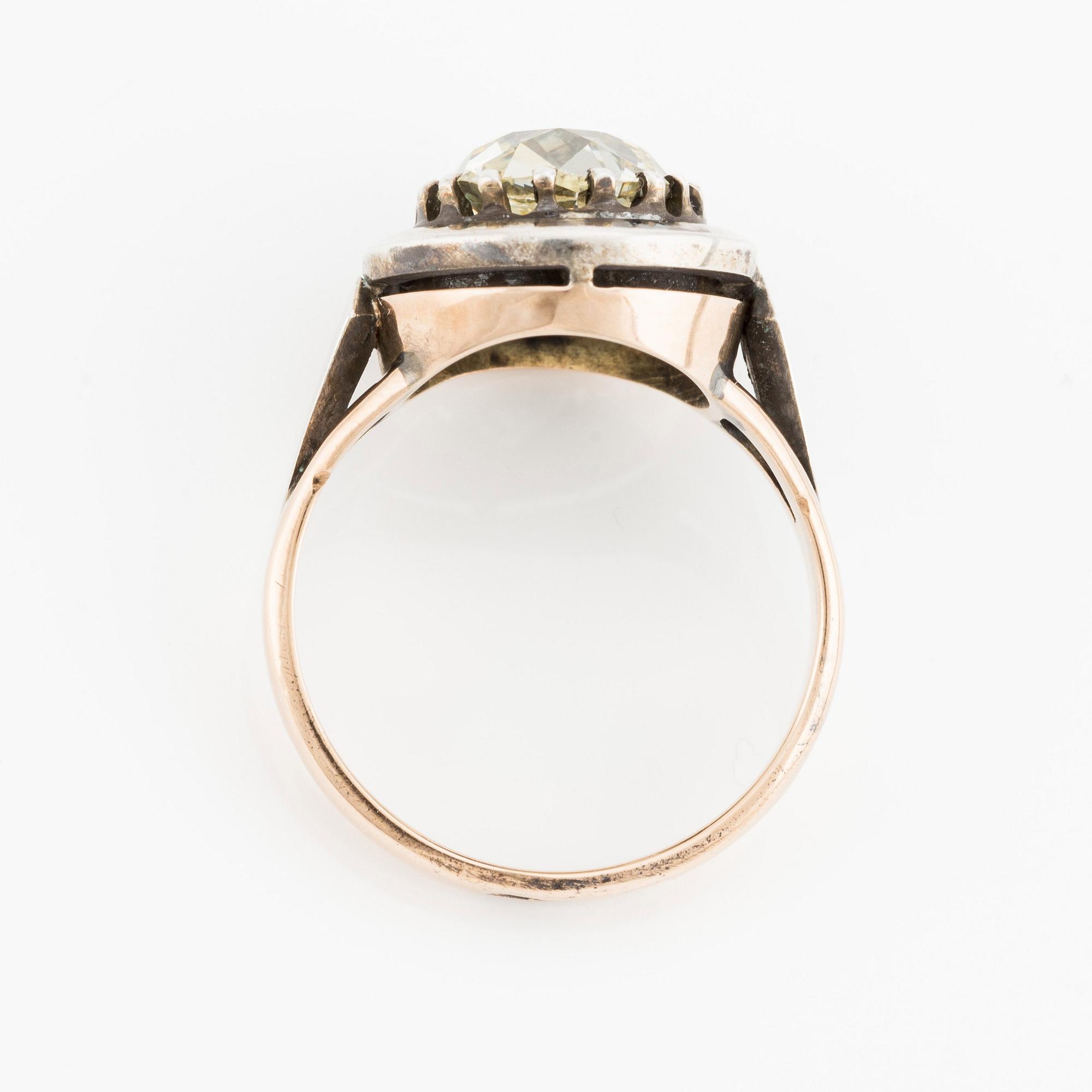 A 14K gold and silver ring with an old-cut diamond.