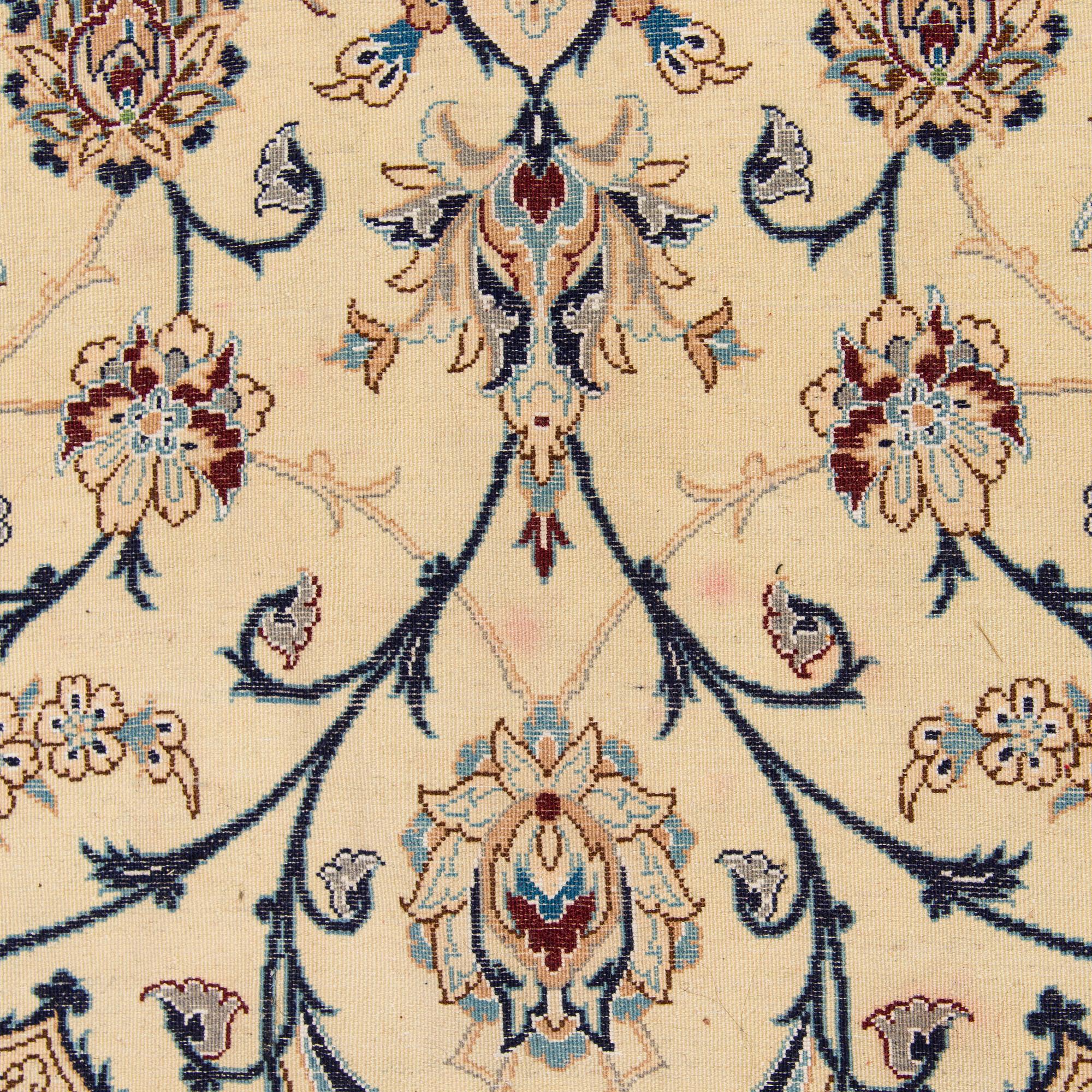 A carpet, Nain, part silk S.K 9LAA. Circa 352x248 cm.