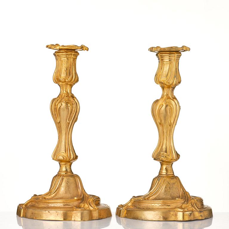 A pair of French 18th century gilt-bronz candlesticks, marked. Louis XV.