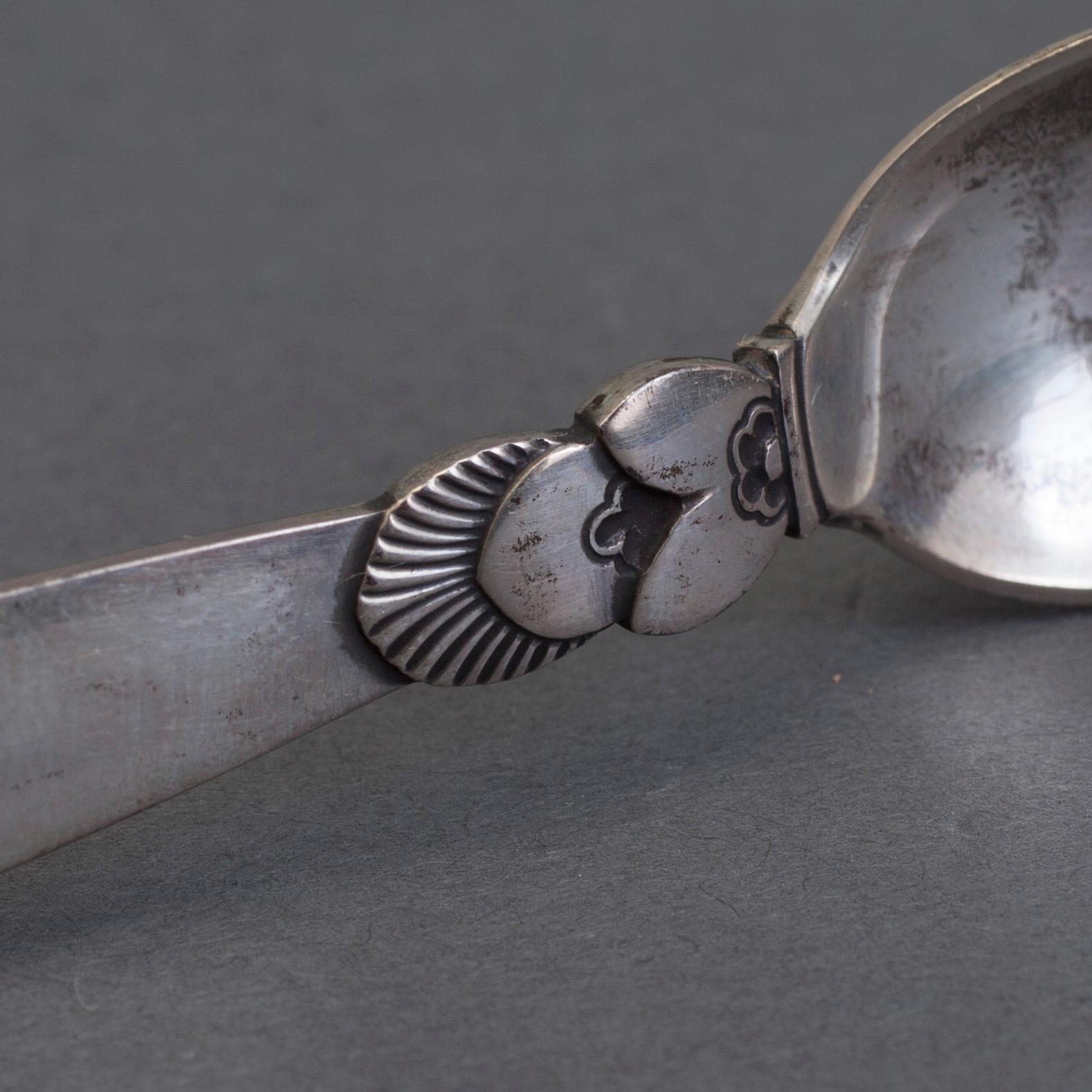 A set of 12+6 spoons by Georg Jensen,