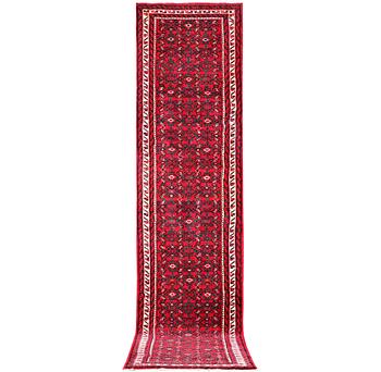 A Hosseinabad runner carpet, c. 395 x 87 cm.