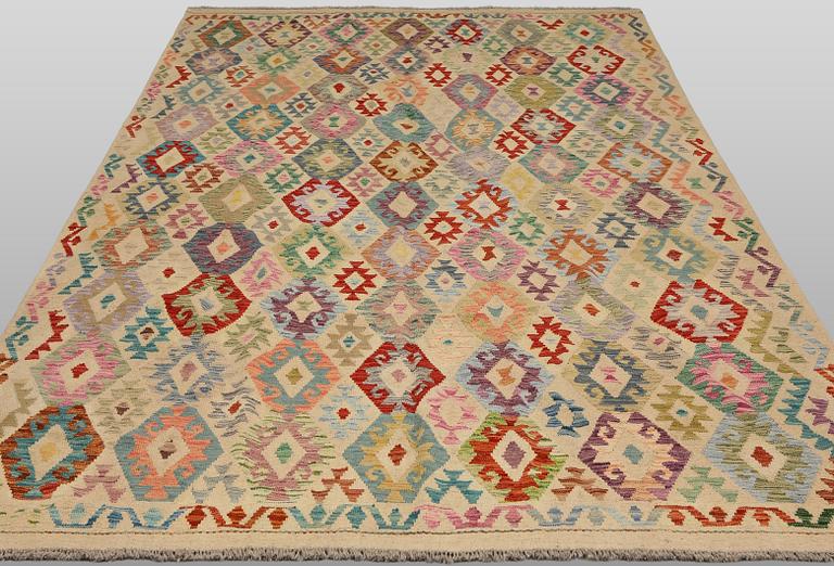 A Kilim rug, approx. 297 x 248 cm.
