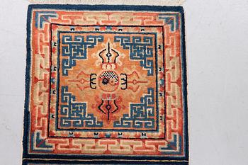 A semi antique chinese meditation rug, ca 159,5 x 57 cm.