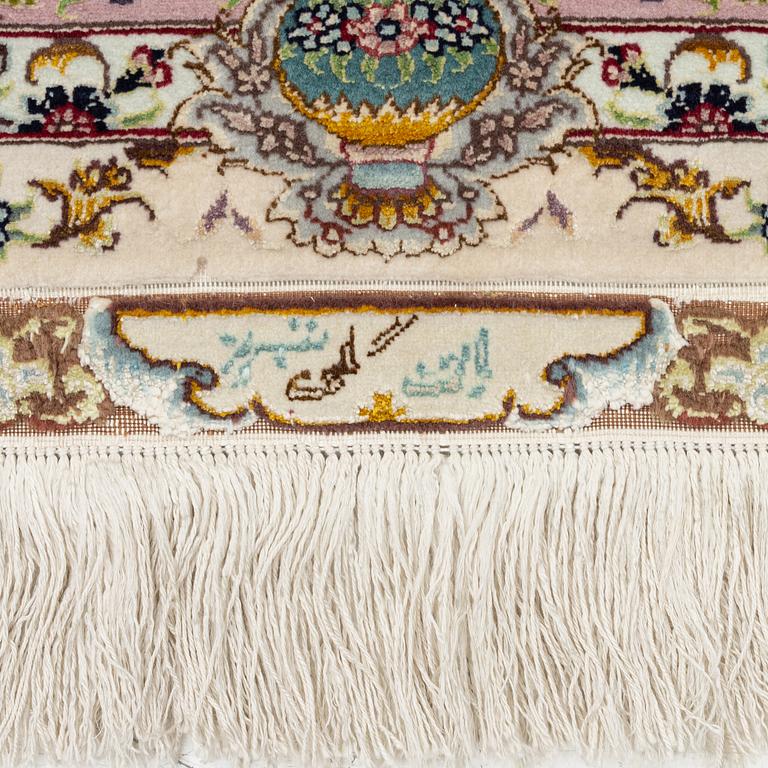 A Tabriz rug, signed, c. 160 x 101 cm.