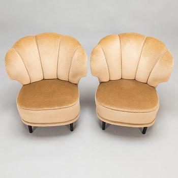 A pair of 1950's armchairs.