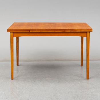 A second half of the 20th century teak veneered dining table.