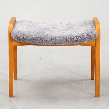 Yngve Ekström, a 'Lamino'  shearling upholstered lounge chair and foot stool from Swedese.