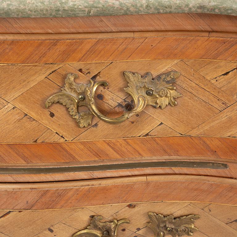 A Swedish rosewood parquetry and gilt brass-mounted rococo commode, Stockholm, later part 18th century.