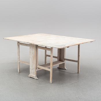 A painted gustavian gate-leg table, around the year 1800.