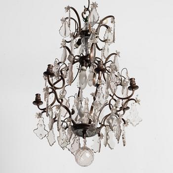 A Rococo style chandelier, early 20th century.