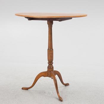 A 19th Century birch tilt top table.