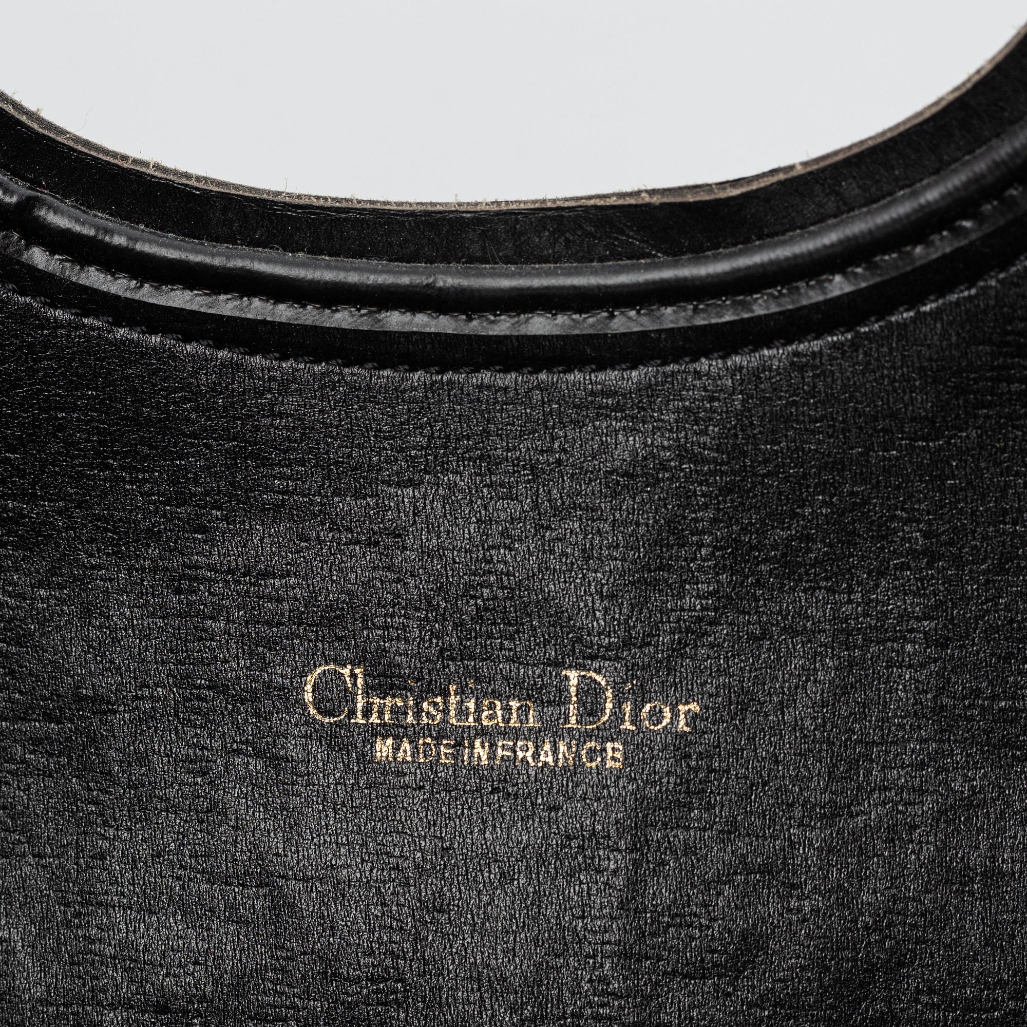 Christian Dior, Oblique fold-over convertible clutch.