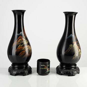 A pair of Japan lacquered vases and a brushpot/bottom for a box, around 1900.