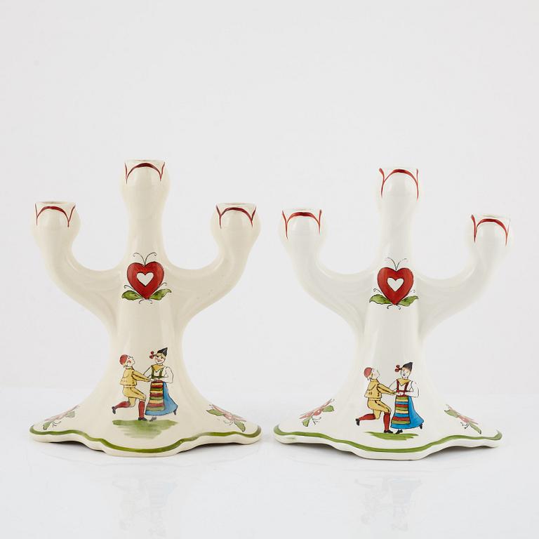 A pair of 'Daladansen' creamware candelabra from Rörstrand, Art Nouveau, early 20th Century.