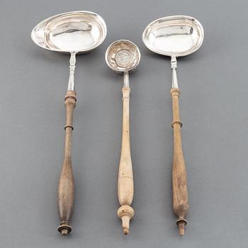 Two 19th century Swedish silver soup-ladles and a silver brandy-ladle.