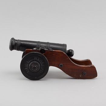 A 20th century salute cannon with wooden gun carriage by Stafsjö Bruk, Sweden.