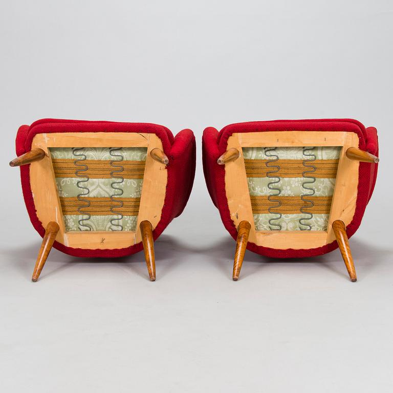 A pair of mid-20th century armchairs.