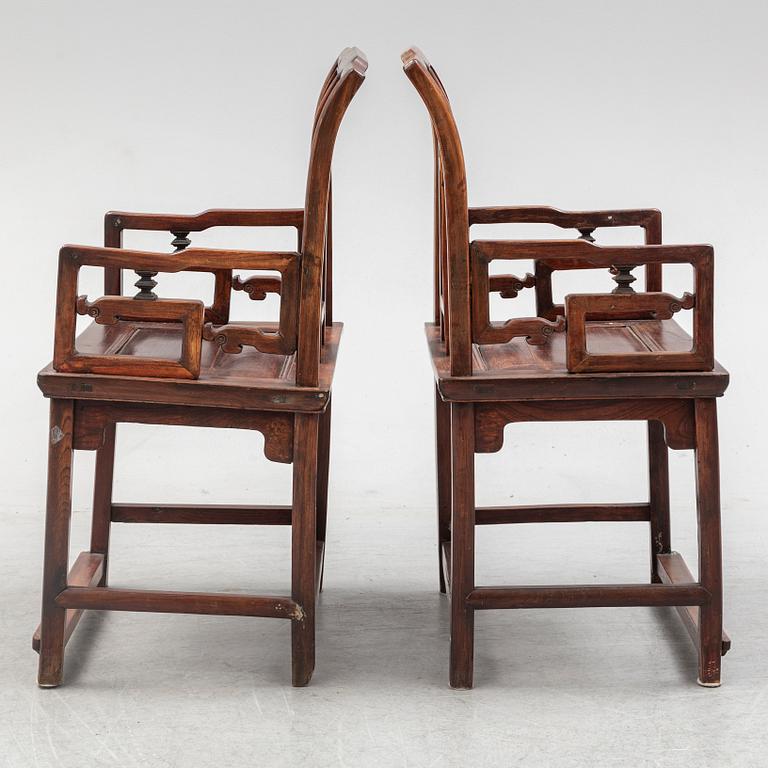 A pair of Chinese hardwood armchairs, early 20th century.