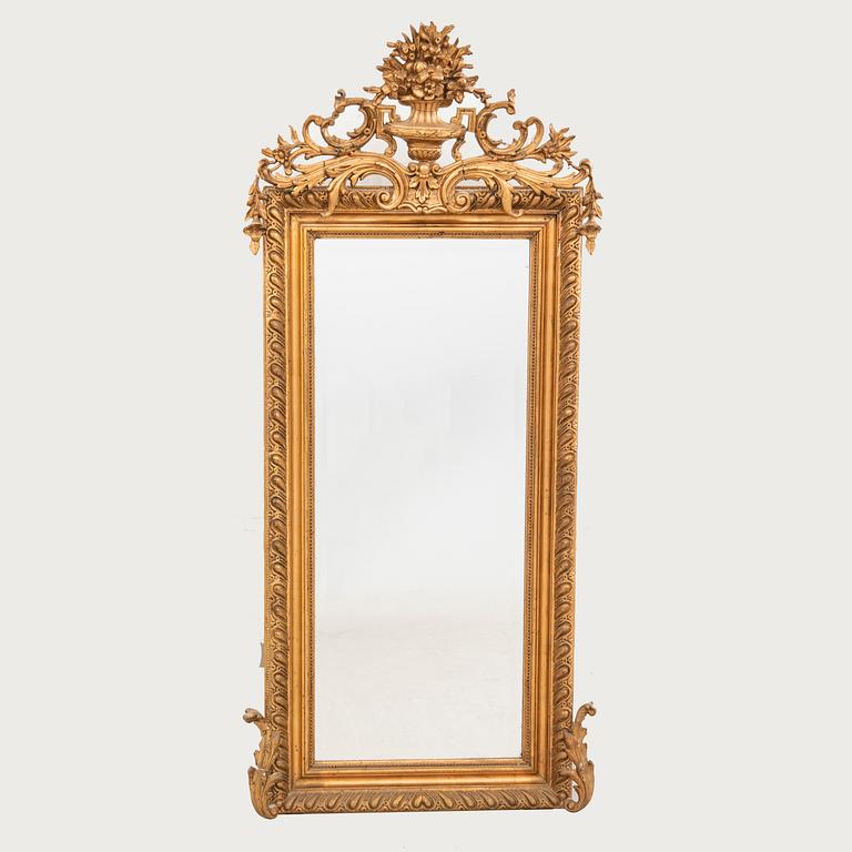A Neo Rococo bronzed mirror around 1900.