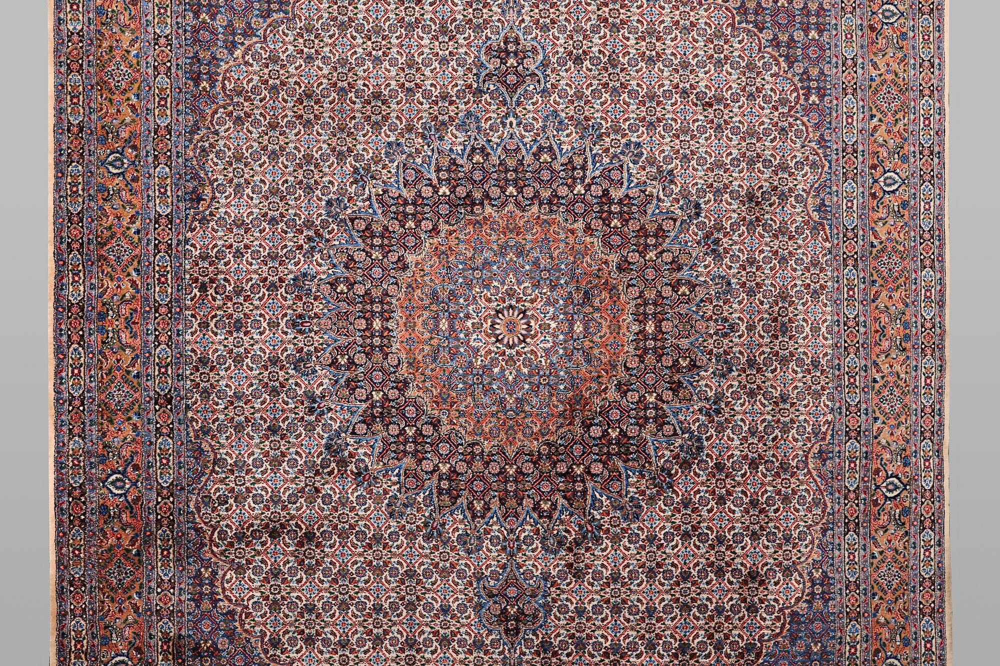 A carpet, Moud, signed, ca 385 x 268 cm.