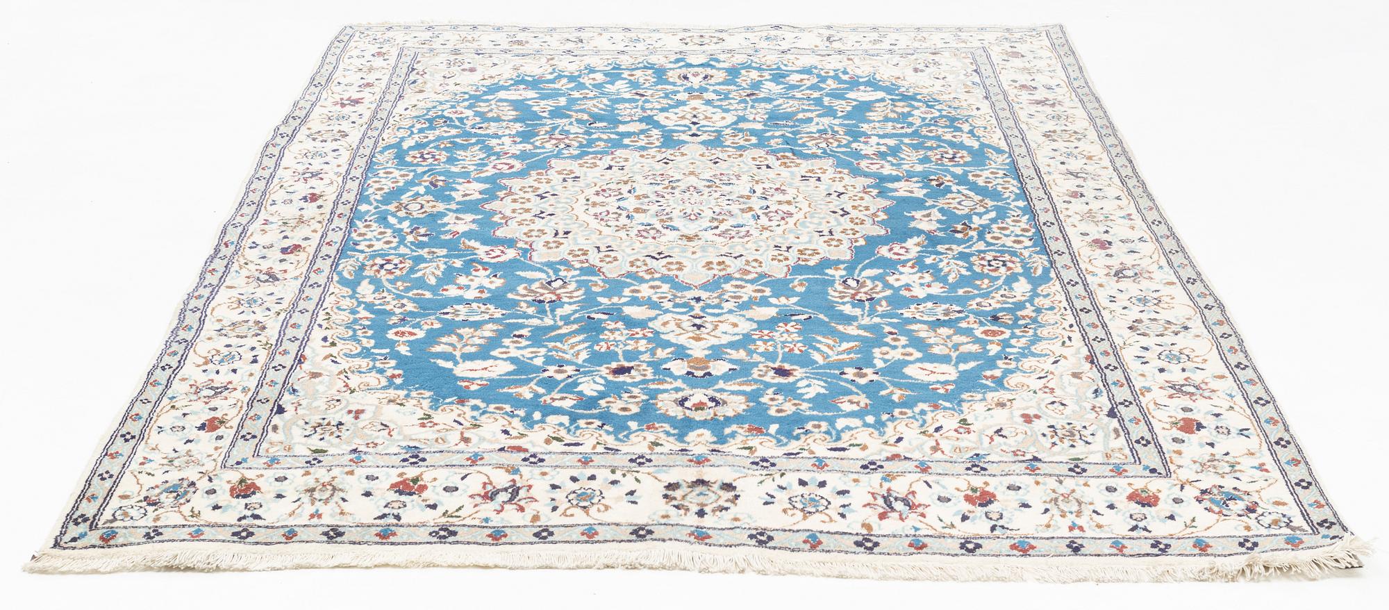 A Nain carpet, circa 310 x 196 cm.