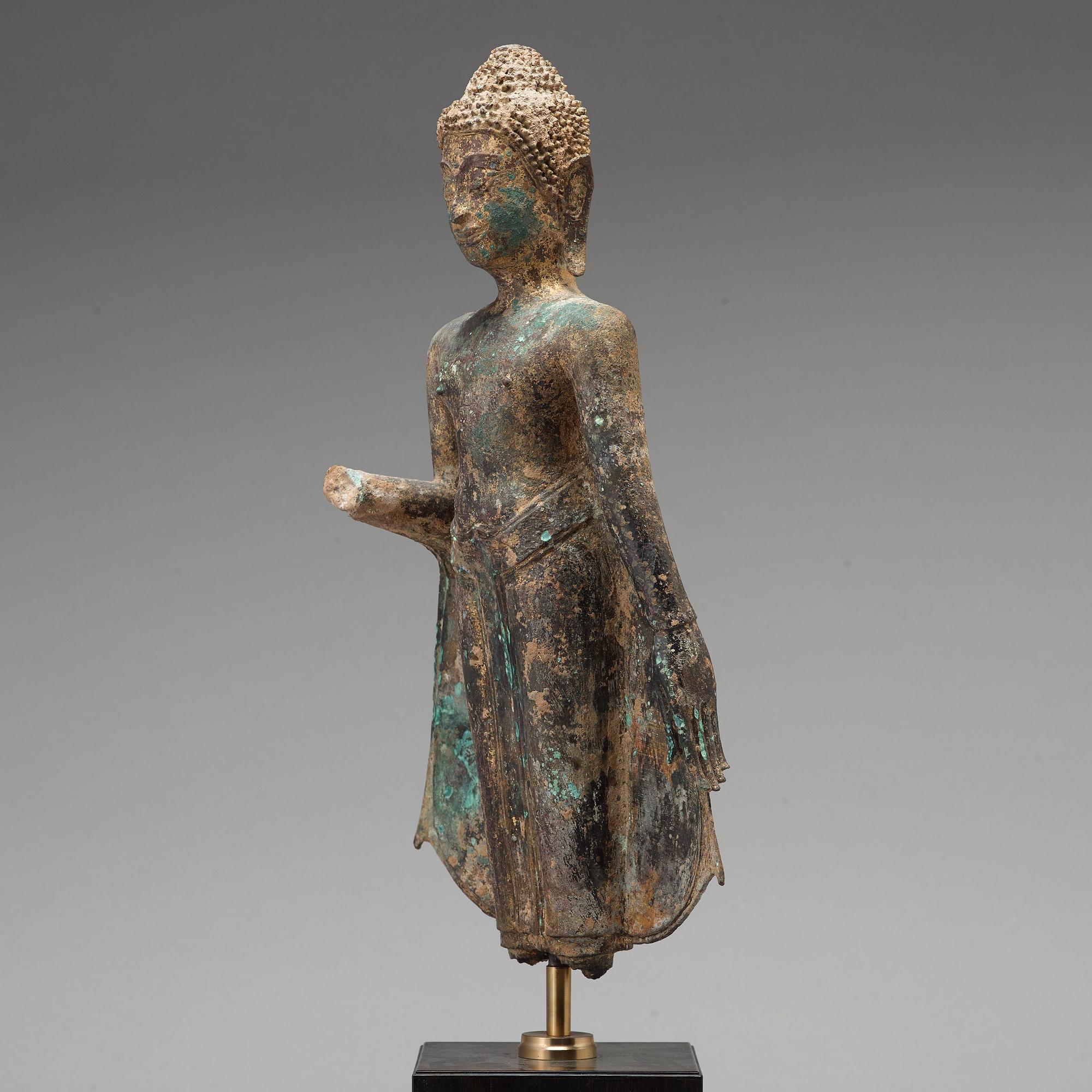 A standing figure of Buddha, Thailand, 18th Century.