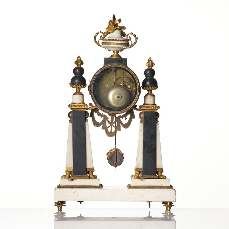 A marble and ormolu Louis XVI portico mantel clock, Paris, late 19th century.