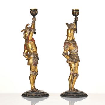 A pair of presumably German knights candlesticks, secound half 19th century.