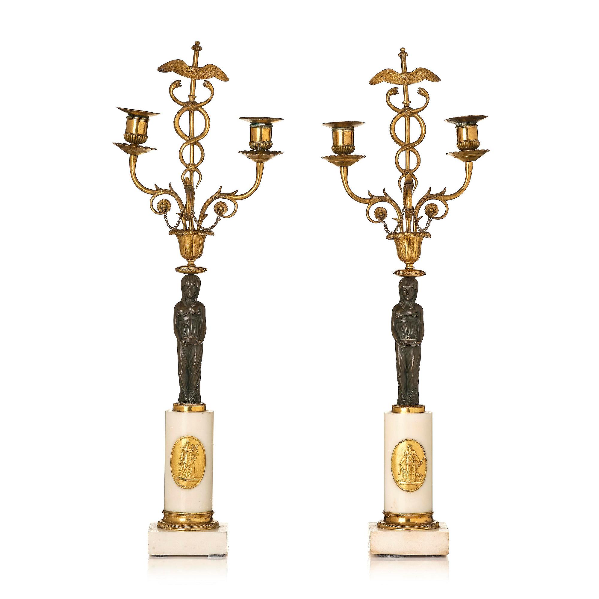 A pair of late Gustavian white marble and bronze candelabra.